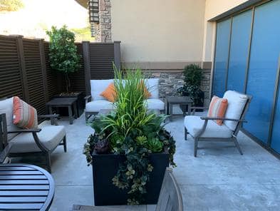 Elegant outdoor seating area featuring silk plants at casino spa.