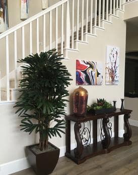 residential-2-2-236x300 Silk plant in a modern living space with artwork and decorative accents.