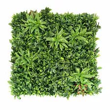 Artificial plant wall with vibrant green foliage for interior decor.