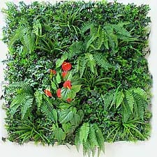 Green wall featuring lush tropical plants and vibrant red flowers.